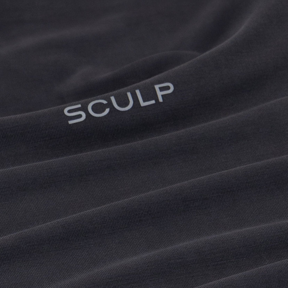 Close-up of a black fabric with 'SCULP' branding.